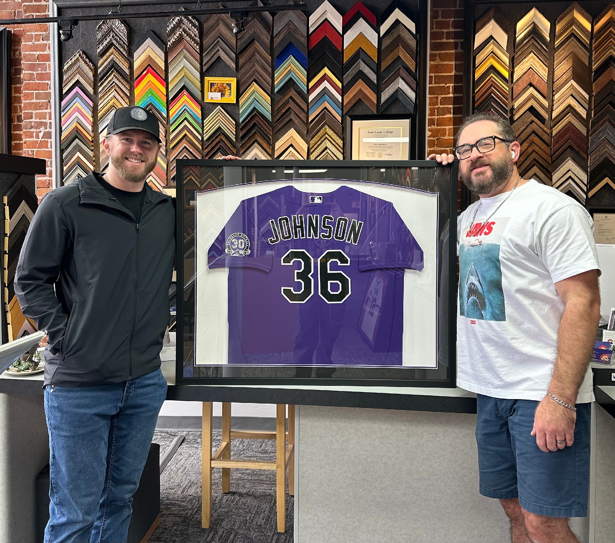 Former Colorado Rockies pitcher Pierce Johnson picking up his custom framed Colorado Rockies jersey