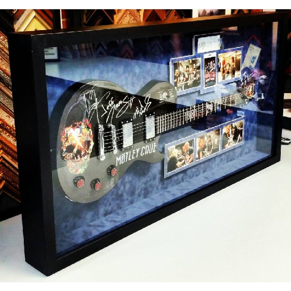 Motley Crue Autographed Guitar and Pictures