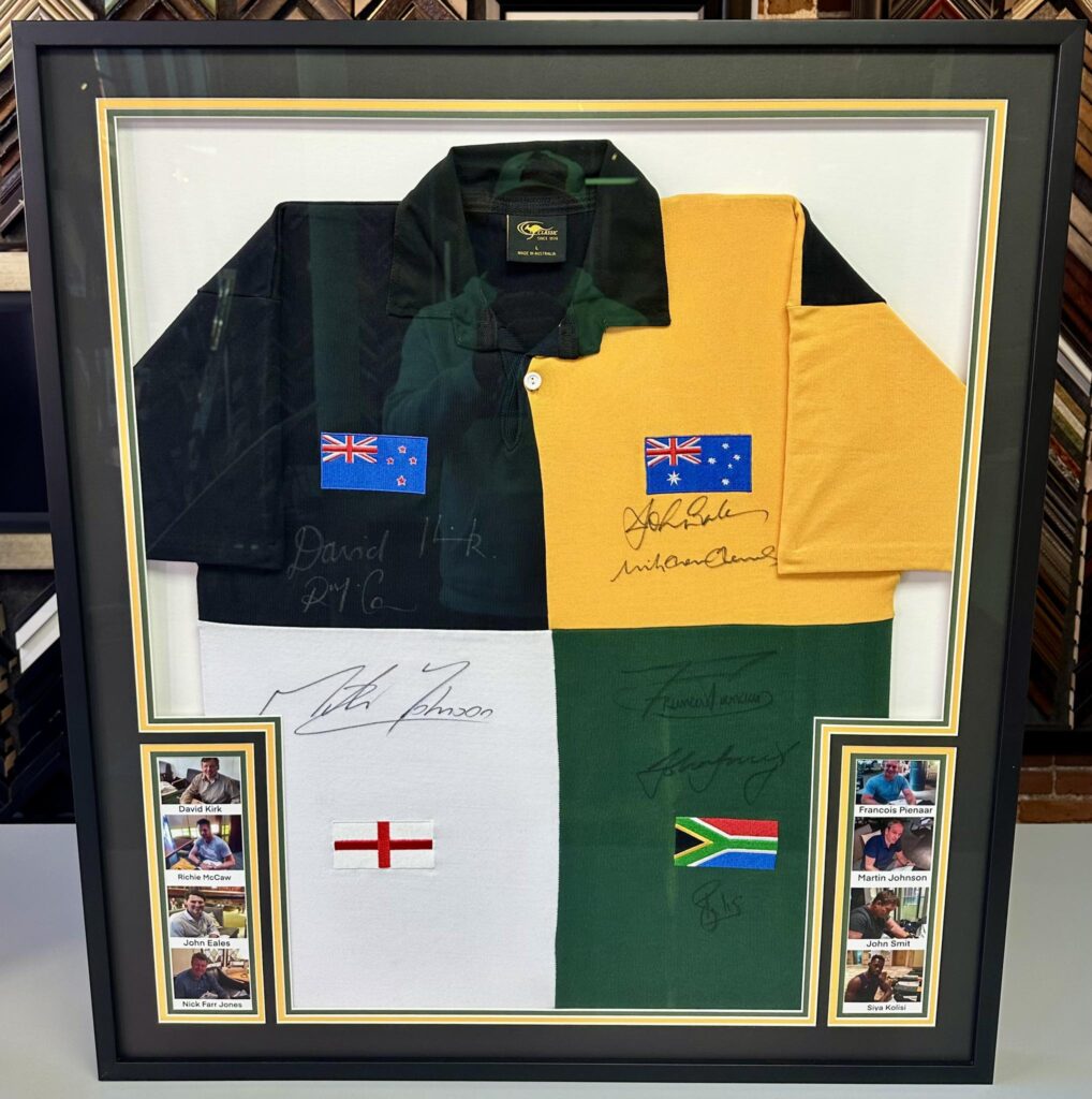 Custom framed piece featuring a jersey signed by all eight Rugby World Cup–winning captains!